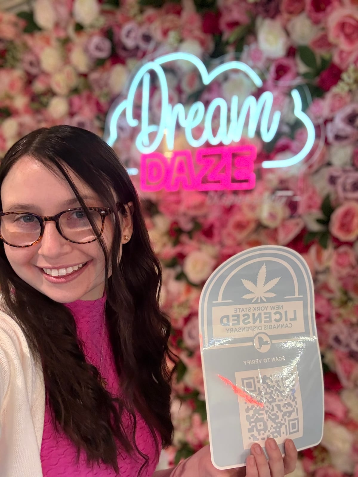 Dream Daze neon sign on the pink flower wall